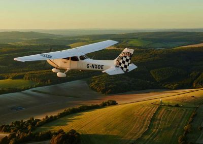 Photo of a plane flying over Goodwood Hotel 