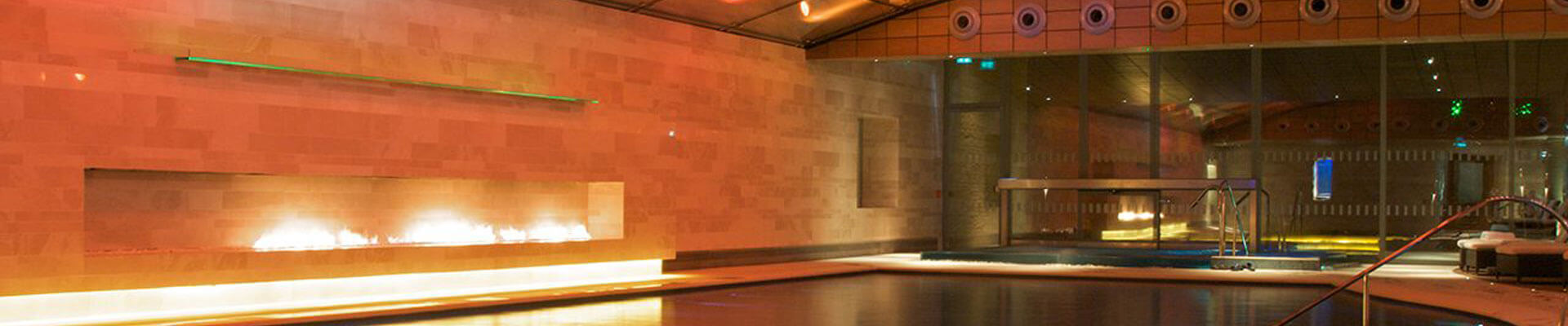 The stunning indoor swimming pool lit up at Lucknam Park Photo of the swimming pool at Lucknam Park