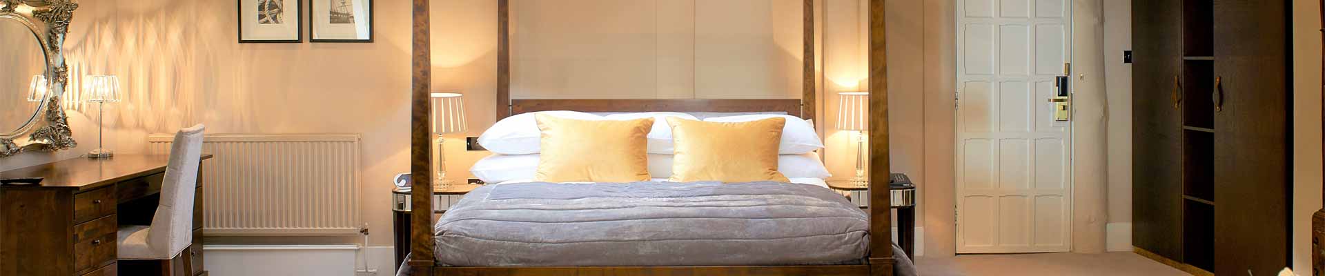 One of the stunning bedroom suites at The Manor Elstree. Photo of one of the bedrooms at The Manor Elstree
