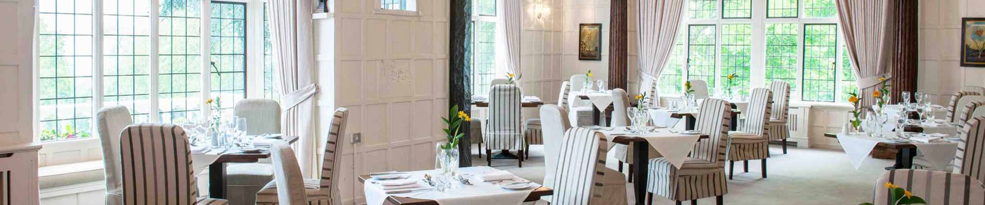 One of the dining rooms at The Manor Elstree Photo of one of the dining rooms at The Manor Elstree